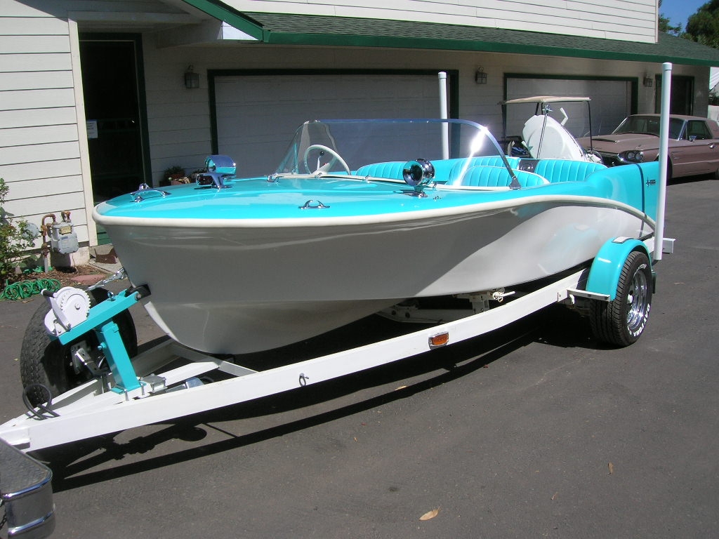 1959 Holiday Fiberglass Boat with a 1959 35HP Johnson engine. 